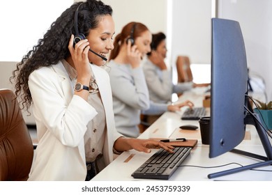 Agent, woman and headset with smile on computer for call center or customer care in office with coworkers. Female person, technology and operator for telecommunication, company and workplace or job