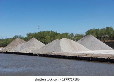Aggregate materials used in construction stockpiled at a facility on the banks of the Cuyahoga River in Cleveland, Ohio