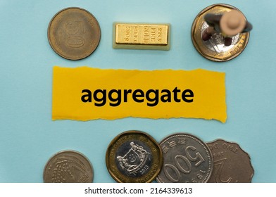 Aggregate.The Word Is Written On A Slip Of Paper,on Colored Background. Professional Terms Of Finance, Business Words, Economic Phrases. Concept Of Economy.