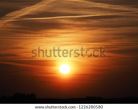 Aggresive sky at sun set with clouds formation seen from european city of Bielsko-Biala in Poland in 2018 cold spring evening on April