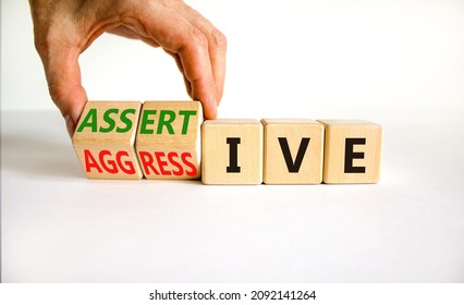 Aggressive or assertive symbol. Businessman turns wooden cubes, changes the word Aggressive to Assertive. Beautiful white background, copy space. Business, psychological aggressive assertive concept. - Shutterstock ID 2092141264