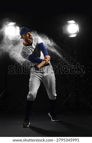 Aggressive baseball player hitting ball with bat, intense sports action, competitive game, studio lighting, dark background