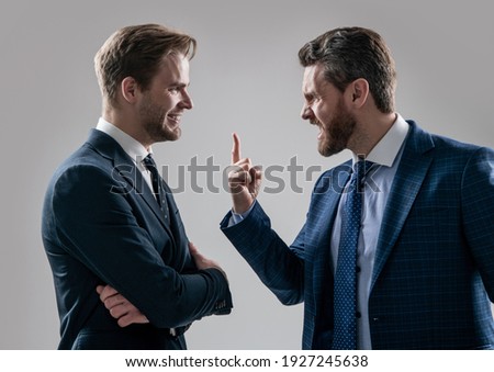 aggressive businessmeeting. struggle for leadership. displeased colleague dispute. businessmen talking and discussing conflict. boss and employee. disagreed men partners. business competition.
