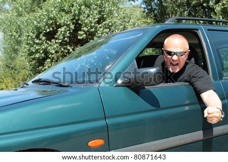 aggressive driver with sunglasses