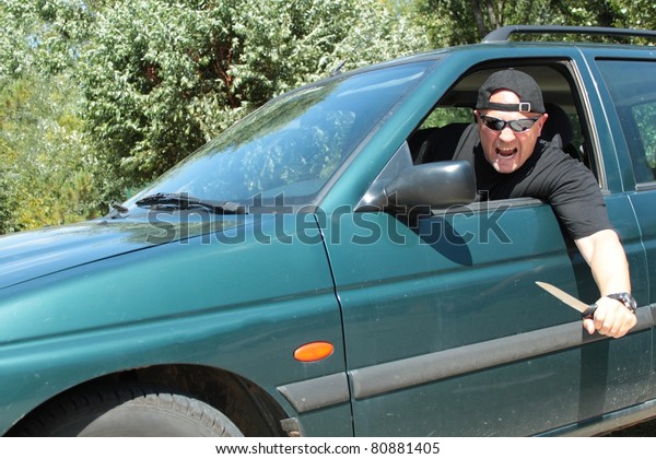 Aggressive driver , young man driving car\
aggressively, Violence at the\
wheel