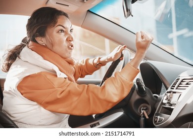 Aggressive Female Driver Swears And Shouts And Gestures At Other Road Users Who Violate Traffic Rules. Concept Of Anger And Emotion Management