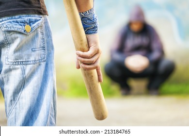  Aggressive Man With A Baseball Bat Against Other Man