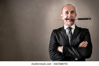 Aggressive manager with knife between teeth