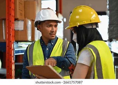 An Aggressive Supervisor reviewing operational errors with a staff member during a warehouse inspection for process improvement and quality assurance.