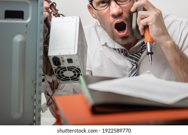 Aggressive Tired Man Trying To Fix Computer With Technical Support And Screaming