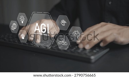 AGI technology concept. Professional using laptop with artificial general intelligence icons, cognitive computing, autonomous systems and digital innovation.