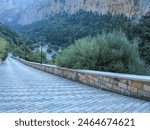       Agia Eleousa  in Greece. The road with slabs to the church.                         