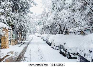 AGIA PARASKEVI, ATTICA, GREECE - FEBRUARY 16 2021: Snowing Day On Athens Suburbs. A Very Rare Weather Phenomenon And Everything Cover With Snow. Winter Day In The City Of Athens