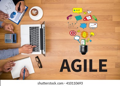 Agile Agility Nimble Quick Fast Concept Business Team Hands At Work With Financial Reports And A Laptop