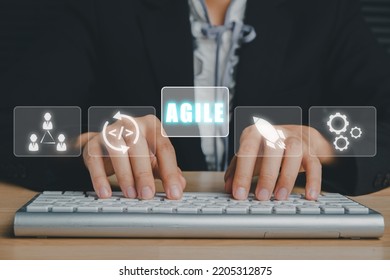 Agile Development Methodology Concept, Business Person Hand Typing Keyboard With VR Screen Agile Icon On Office, Technology Concept.