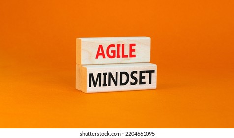 Agile Mindset Symbol. Concept Words Agile Mindset On Wooden Blocks. Beautiful Orange Table Orange Background. Business Flexible And Agile Mindset Concept. Copy Space.