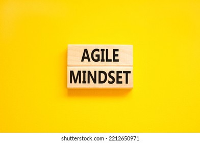 Agile Mindset Symbol. Concept Words Agile Mindset On Wooden Blocks. Beautiful Yellow Table Yellow Background. Business Flexible And Agile Mindset Concept. Copy Space.