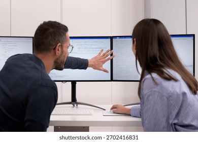 Agile Pair Programming And Extreme Coding: Two Developers Collaborating At Desks.