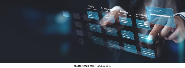 Agile software development. Business developer using computer with Kanban board framework on futuristic virtual screen interface, lean project management tool for fast changes concept - Shutterstock ID 2206536811