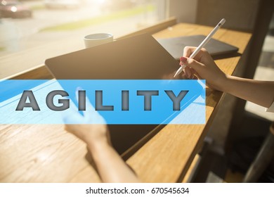 Agility text on virtual screen. Business technology and internet concept. 