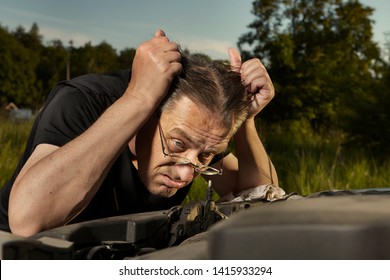 Aging Desperate Man Trying To Fix Broken Car Engine On Lonely Way