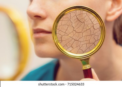 aging and dry face skin concept - woman with magnifying glass