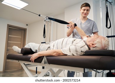 Aging Person Working Out On Rehabilitation Equipment