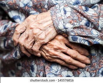 Aging process - very old senior woman hands wrinkled skin