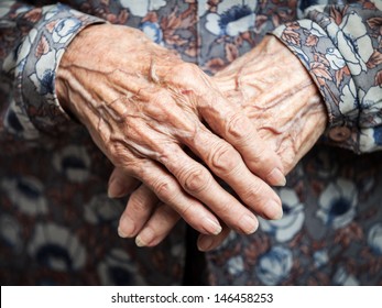 Aging process - very old senior woman hands wrinkled skin