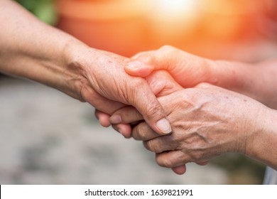 Aging Society Concept. Hands Of Old People Holding Support Each Other In Nursing Home