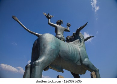 Agios Nikolaos / Greece - September 27: The statue of Europe is sitting on a bull. Sculpture of Europe, mother of King Minos, riding a bull in Agios Nikolaos, Crete, Greece. Monuments on the isl