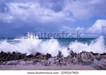Agitated sea seen from the beach of Cefalù in Sicily, Italy