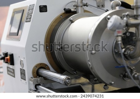 Agitator bead mill with horizontal grinding chamber. Selective focus.