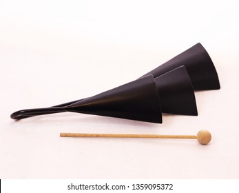 Agogo bells with a wooden stick