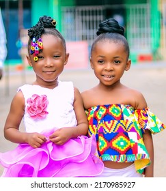 Agona Swedru, Ghana. 10.06.2022. Portrait Of Two Cute African Girls. Adorable Kids Posing For Camera