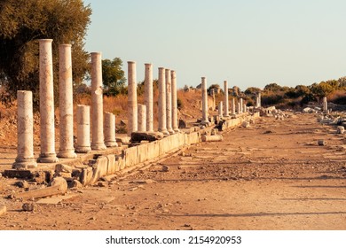 Agora in Side Ancient City.  Columns, fragments of the ancient city. Antique market square.  Columns and foundations of an ancient temple during sunset.