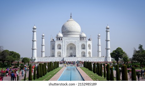 Agra, India - 03-27-2022 : the beautiful monument of love with blue water fountains