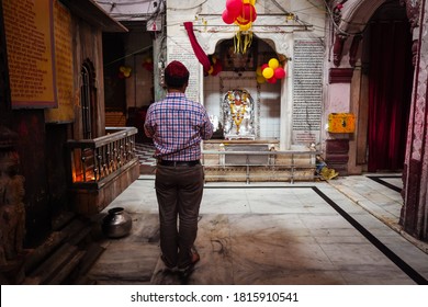 Agra / India - February 22, 2020: Man Praying At Hindu Temple In Historic Agra Downtown