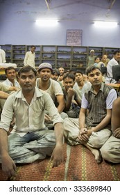 AGRA, INDIA, JULY 19: Group Of Indian Men Workers Working For Tara Organization Fair Trade In Agra, Sitting And Waiting To Receive Their Annual Medical Insurance, India 2010.