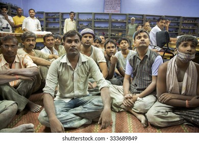 AGRA, INDIA, JULY 19: Group Of Indian Men Workers Working For Tara Organization Fair Trade In Agra, Sitting And Waiting To Receive Their Annual Medical Insurance, India 2010.