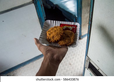 AGRA, INDIA - JULY 28, 2016: The Kachori Cookies On My Hand In The Train. It's An Indian Food.