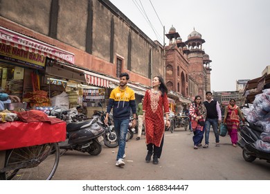 Agra / India - March 15, 2020: East Asian Young Woman (Chinese Ethnic) Tourist With Local Indian Travel Guide Visiting Old Agra Downtown, Near Agra Fort