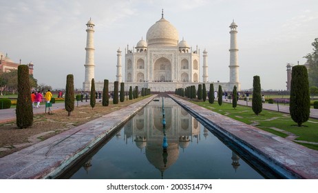 AGRA, INDIA - MARCH, 26, 2019: the taj mahal and fountain pool in agra on a spring morning