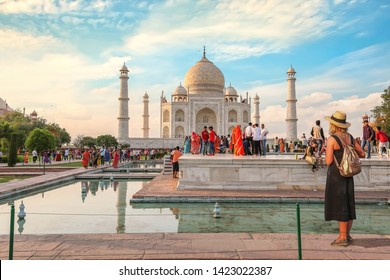 Agra, India, May 29, 2019: Taj Mahal Mausoleum At Sunset With View Of Female Tourist Enjoying The View At Agra, India