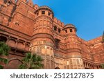 Agra Red fort architecture details. Historic Mughal Indian architecture at Red fort Agra. Old fort made of red sandstone and intricate carved stone artwork. Red Fort is a UNESCO World Heritage site.