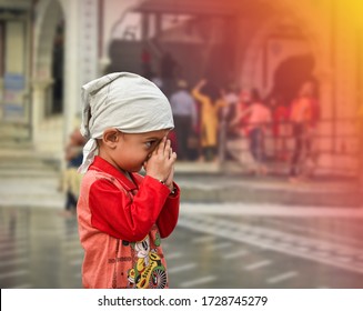 Agra, Uttar Pradesh/ India - August 18 2019: View Of An Indian Sikh Kid Praying In The Gurudwara Sahib At Agra, India