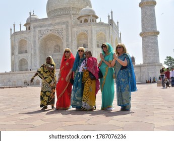 Agra, Uttar Pradesh  / INDIA - May 19, 2019: French Women Wearing Saree Giving Greetings With Indian Women Infront Of Tajmahal. About One Million French Tourists Visits Tajmahal Each Year. 