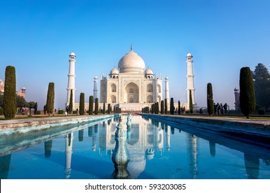 Agra, Uttar Pradesh, India - The morning view of Taj Mahal monument reflecting in water of the pool, Agra, India - Shutterstock ID 593203085