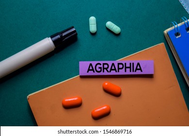Agraphia text on sticky notes. Office desk background. Medical or Healthcare concept
