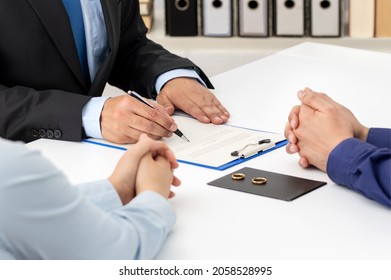 Agreement prepared by lawyer signing decree of divorce or dissolution and cancellation of marriage, husband and wife during divorce process with lawyer and signing of divorce contract.